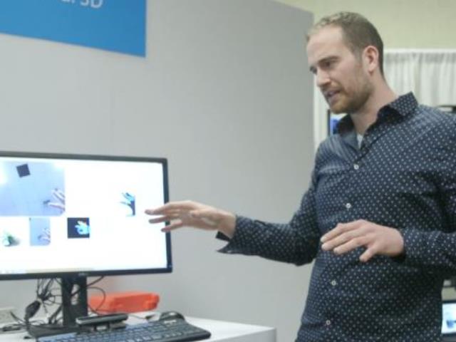 a person standing in front of a computer