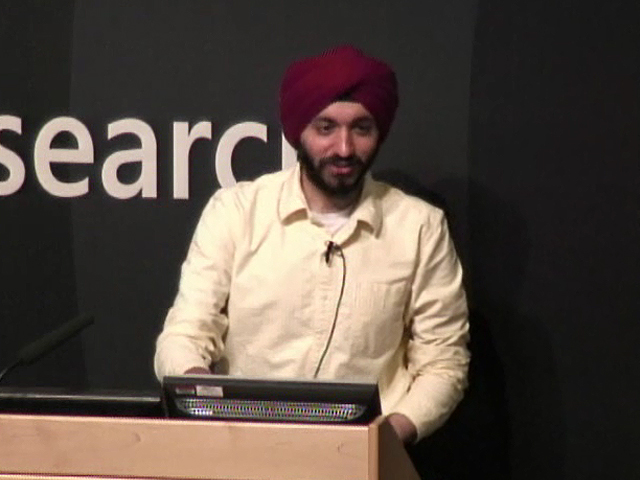 a man standing in front of a laptop computer