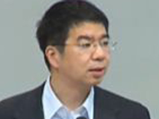 Jason Cong wearing a suit and tie