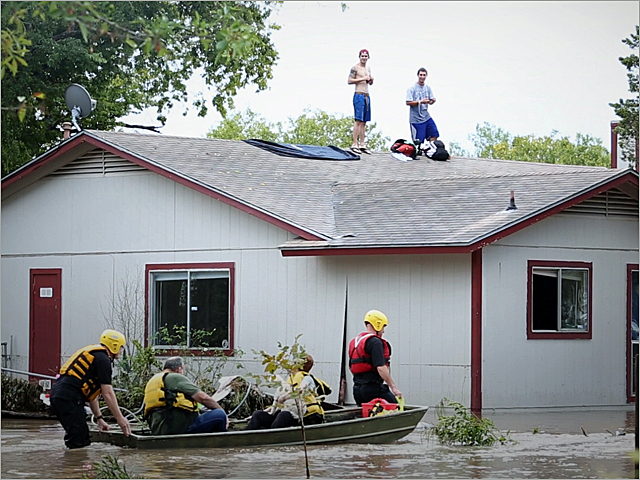 a group of people riding on the back of a boat