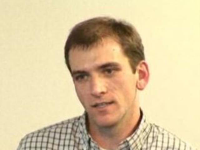 a man smiling for the camera