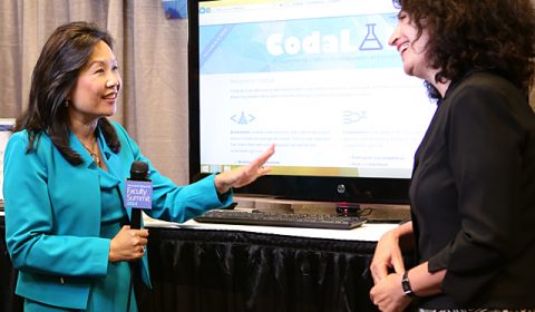 a person standing in front of a screen