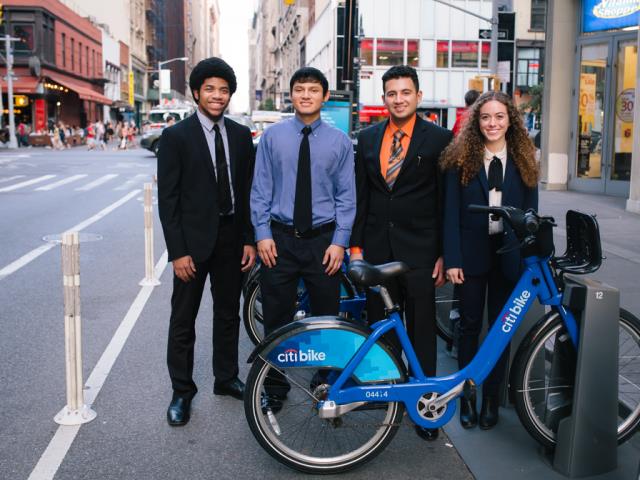 a group of people standing in front of a building
