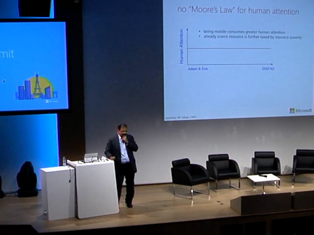 a man standing in front of a computer screen