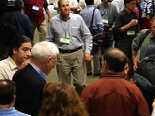 a group of people standing in front of a crowd