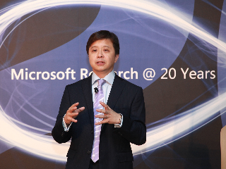 Hsiao-Wuen Hon wearing a suit and tie