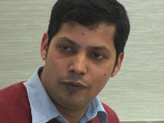 a man smiling for the camera