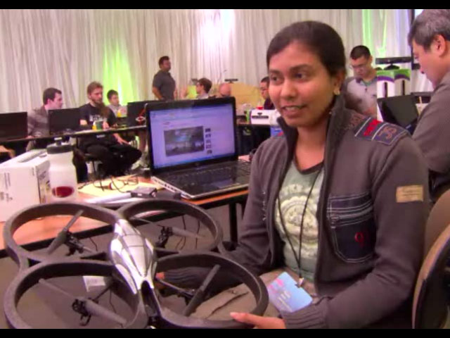 a group of people sitting at a computer