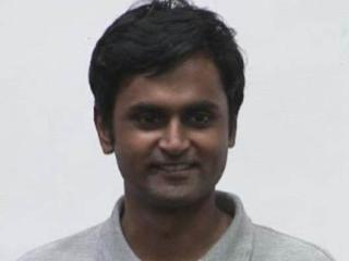 a man smiling for the camera