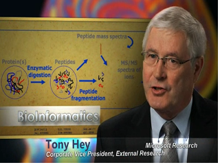 a screen shot of Tony Hey in a suit and tie