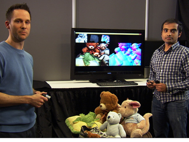 a man standing in front of a television