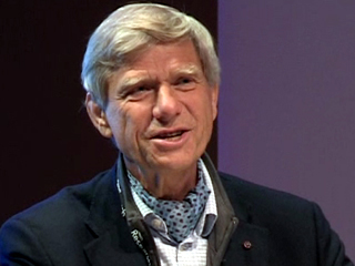 Hermann Hauser wearing a suit and tie