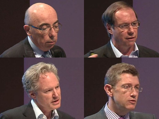 Eric Horvitz et al. looking at a man in a suit and tie