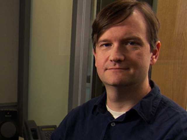 a person smiling for the camera