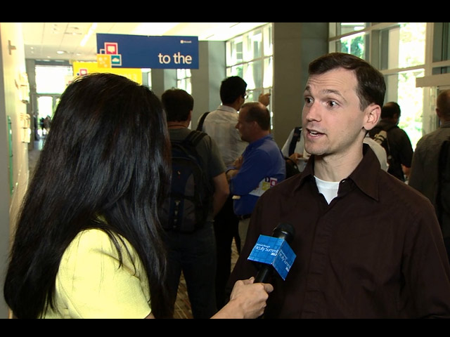 Michael Bernstein et al. standing in front of a window