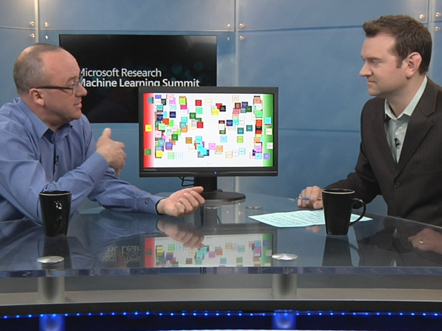 Chris Cashman standing in front of a computer