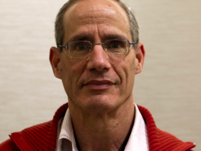 Noga Alon wearing glasses and smiling at the camera