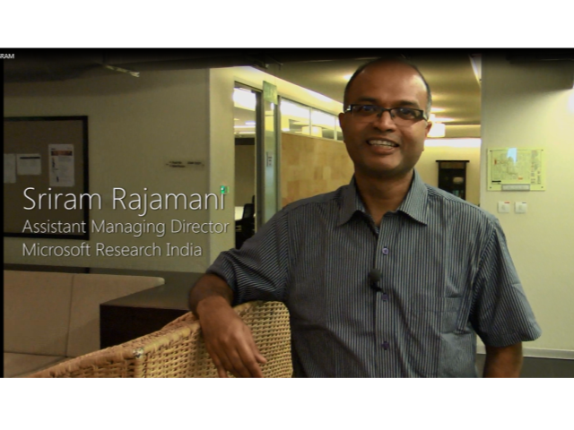 Sriram Rajamani standing in a room