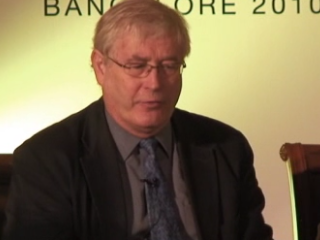 Tony Hey wearing a suit and tie