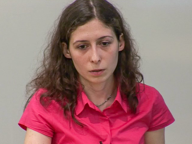 a woman in a pink shirt