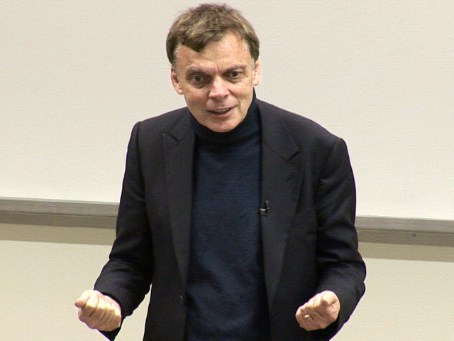 Graeme Simsion wearing a suit and tie
