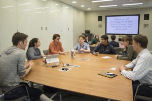 a group of people sitting at a table