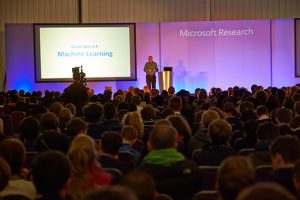 a group of people standing in front of a crowd