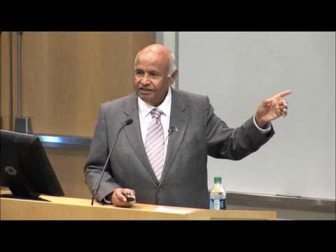 Vijay Bhargava wearing a suit and tie