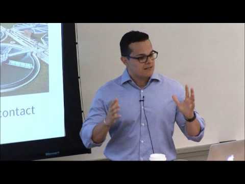 a man standing in front of a screen