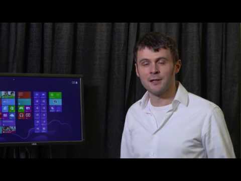 a man standing in front of a screen