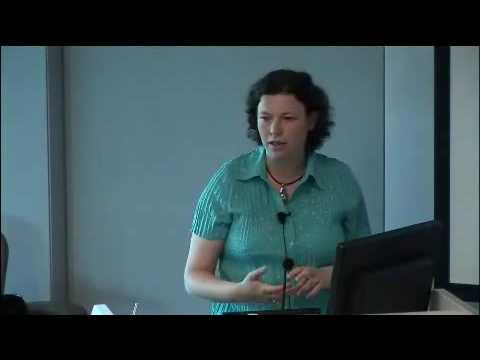 a person standing in front of a screen