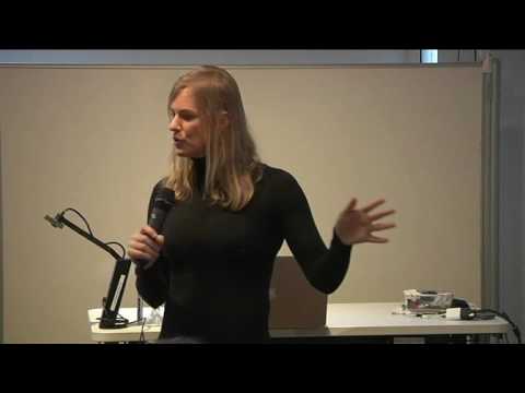 a woman standing in front of a mirror posing for the camera