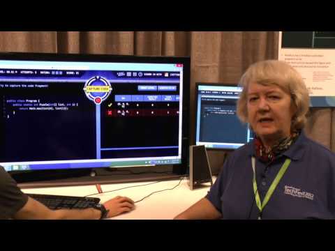 Judith Bishop standing in front of a computer screen