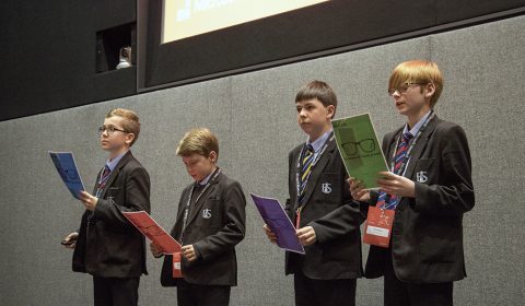 Mattie Stepanek et al. standing next to a man in a suit and tie