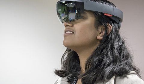 a woman wearing a hat and glasses