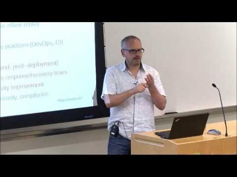 a man standing in front of a screen