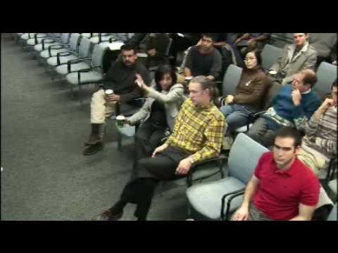 a group of people sitting in front of a crowd