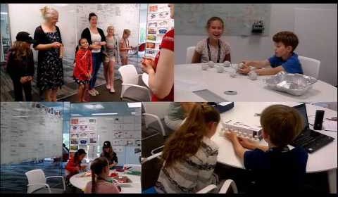 a group of people sitting in front of a crowd