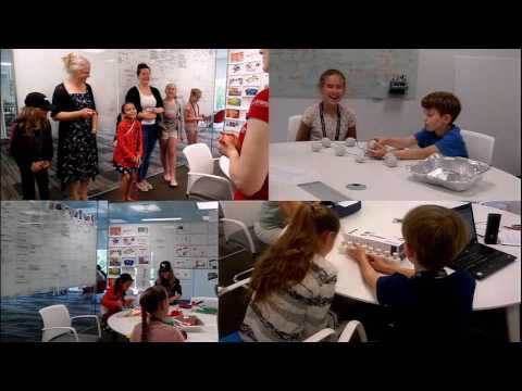 a group of people sitting in front of a crowd