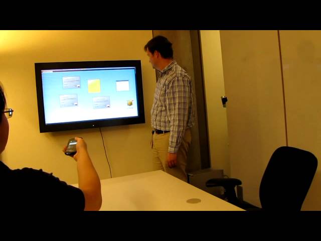 a man standing in front of a television