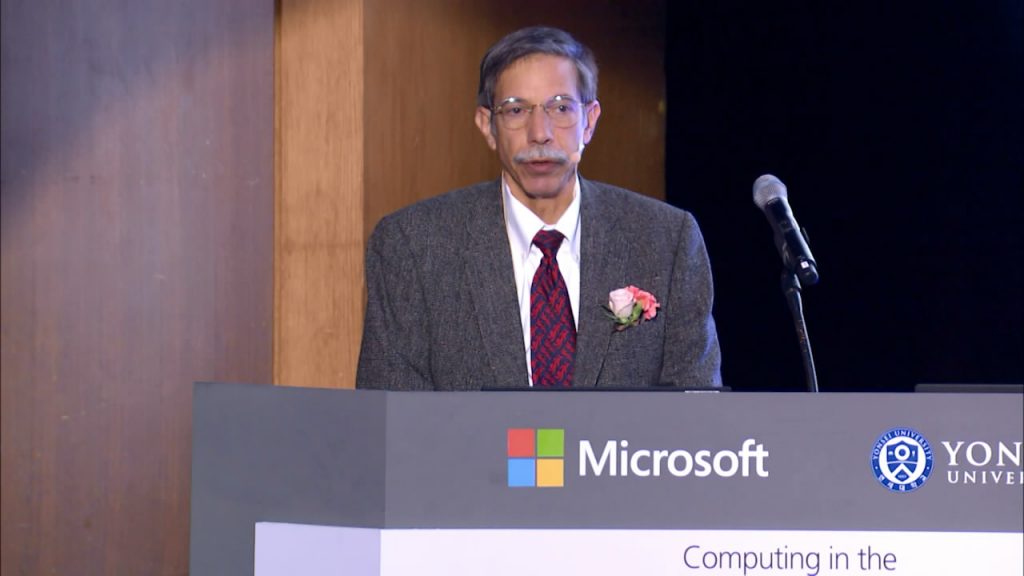 a screen shot of a man in a suit and tie