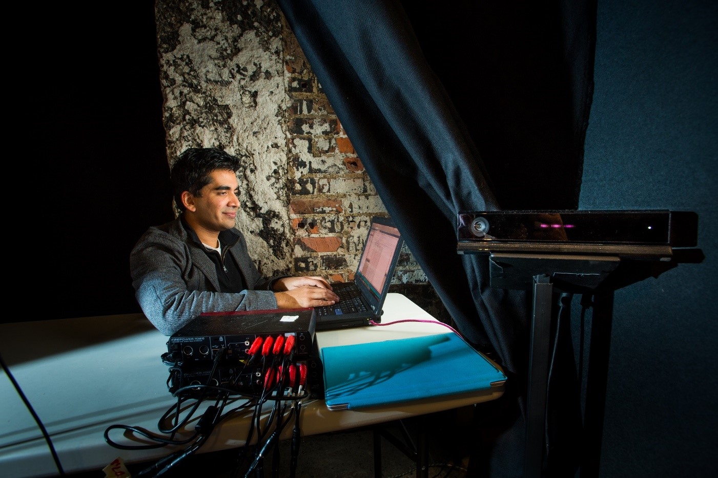 Microsoft researcher Neel Joshi works on the Kinect-enabled sound system of “The Oregon Project.”