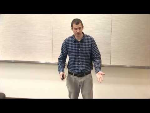 a man standing in front of a wall