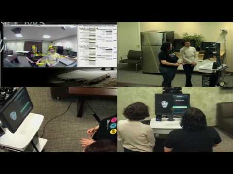 a group of people sitting at a desk