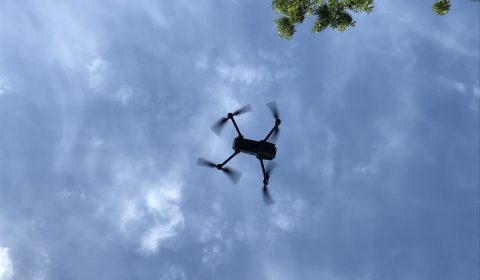 a person flying through the air on a cloudy day