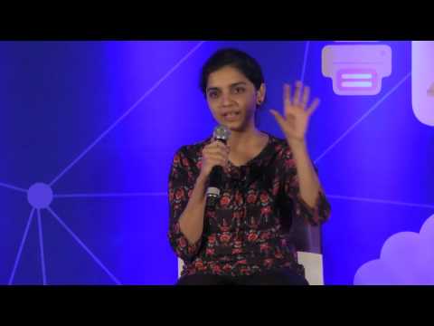 a woman standing in front of a stage