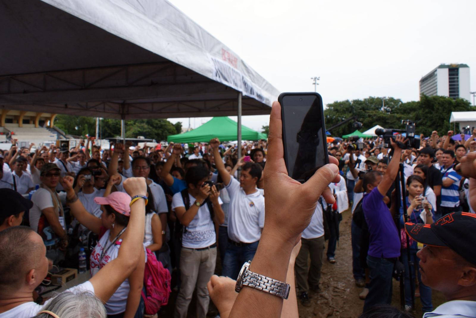 a group of people standing in front of a crowd