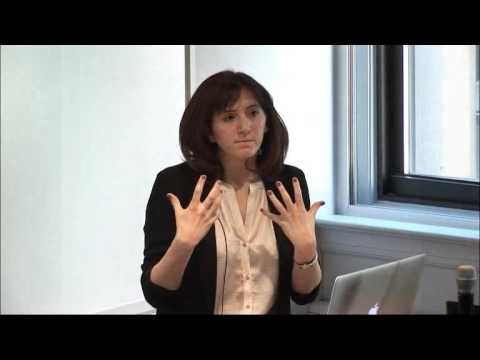 a woman standing in front of a window