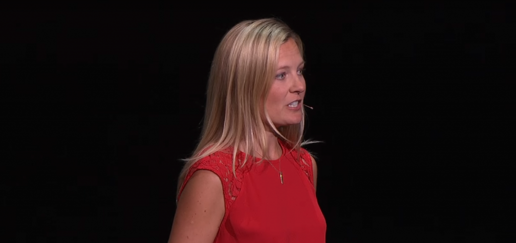 a woman standing in a dark room