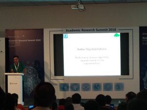 a group of people standing in front of a television